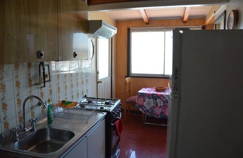 Concon House | The Brown House, in front of the Ocean next to the beach and waves at La Boca