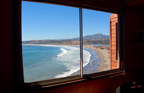 Concon House | The Brown House, in front of the Ocean next to the beach and waves at La Boca