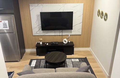 Northeast Edmonton House | The Cozy Parlor- a stylish and family-friendly space that feels just like home.