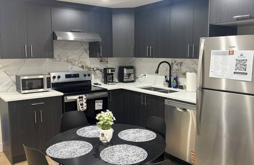 Northeast Edmonton House | The Cozy Parlor- a stylish and family-friendly space that feels just like home.