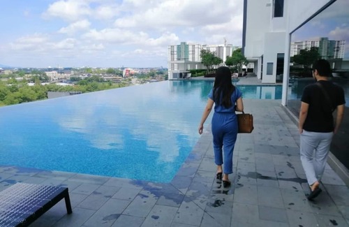 Central District Apartment | The Cribs Homestay where u can enjoy our stunning view by the pool.