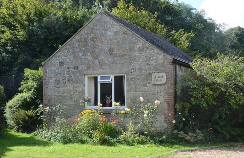 Godshill Cottage | The Granary at French Mill: charming cottage set in extensive garden with stream