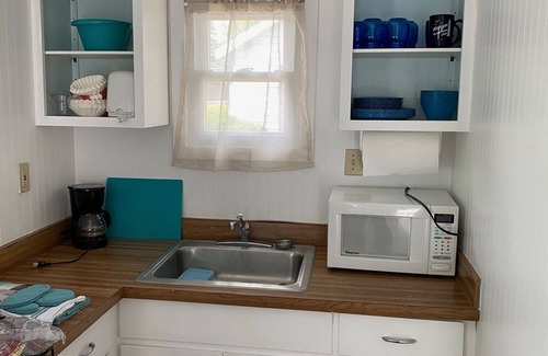 Oscoda Cottage | The Hideaway- Haven on HuronnA fresh and airy cabin directly on Lake Huron!