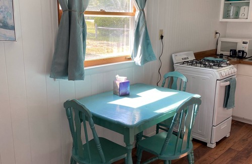 Oscoda Cottage | The Hideaway- Haven on HuronnA fresh and airy cabin directly on Lake Huron!