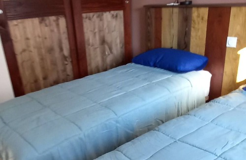 Le Massegros Ski Chalet | The hut at the bottom of the garden