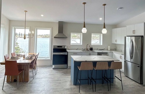 Halifax County House | The Luxurious Lakefront Reset on Porters Lake with private beach and hot tub!