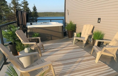 Halifax County House | The Luxurious Lakefront Reset on Porters Lake with private beach and hot tub!