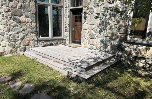 Puposky Cottage | The newly remodeled Stone Cabin with sandy beach and clean clear water