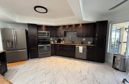 Berkeley Manor House | The Perfect Gateway Home with a large pool area, Gazebo, all fenced in.