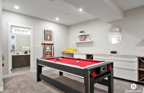 Southeast Calgary House | The Ultimate Estate Featuring - Karaoke, Air Hockey, Pool Table, Patio, BBQ Space, King Bed, Board Games, Library & More!