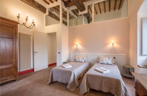 Stigliano Apartment | This apartment is located in a historic tower in the Castello del Poggiarello, a beautiful and chara