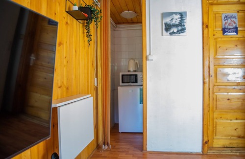 Busteni Apartment | This apartment includes a seating area, a flat-screen TV with games console.