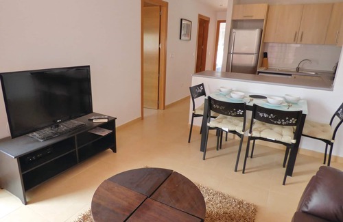 Alhama de Murcia Apartment | This beautiful apartment is located in a quiet corner of a resort complex with a communal pool and o