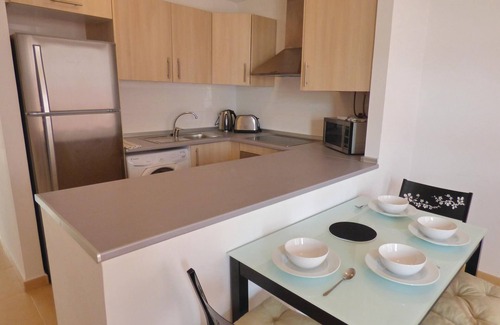Alhama de Murcia Apartment | This beautiful apartment is located in a quiet corner of a resort complex with a communal pool and o