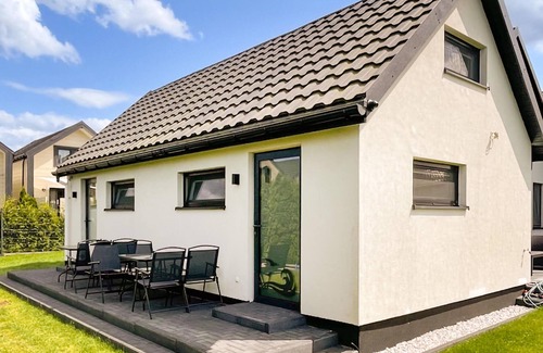 Grzybowo House | This beautiful and bright vacation home is just a short walk from the sandy beach.