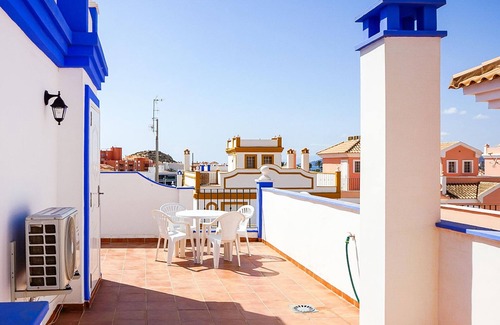 San Juan de los Terreros House | This beautiful Andalusian vacation home welcomes you with community pool near the beach.