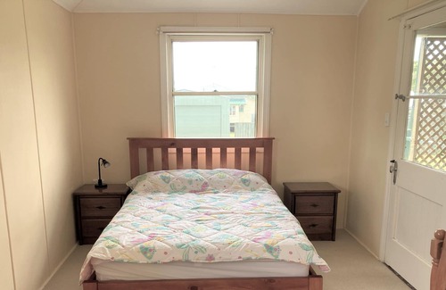 Tin Can Bay House | This comfy cottage is centrally located and waking distance to the Marina