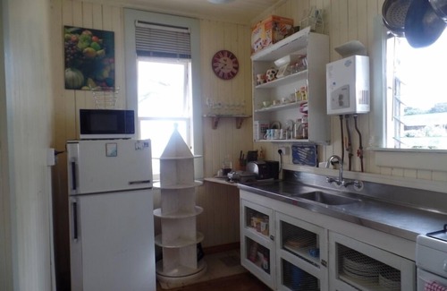 Opononi House | This is the one, pristine kiwi bach by the water!