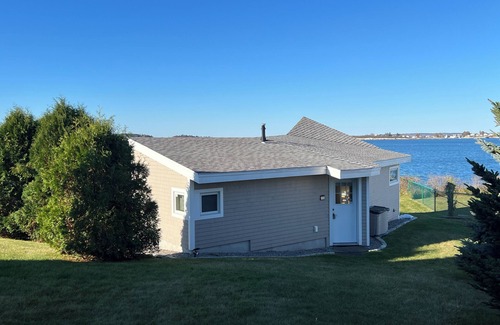 Mid-Coast and Islands Cottage | This sweet cottage offers a shared pebbly beachfront and gorgeous sunset views