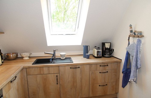 Eilsum Apartment | TiefBlick - New 80sqm apartment for 4 pers. + 2 dogs with fireplace, balcony &