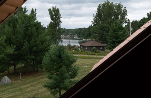 Alban Cottage | Timber Frame Log Cottage, across from the French River, great for big families