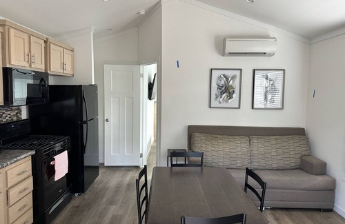 New Caney Cottage | Tiny Home Big Amenities: pool/hot tub, laundry, camp store, near Houston