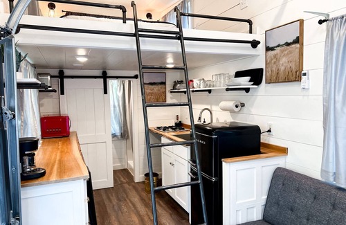 Montrose House | Tiny home located beside a creek.