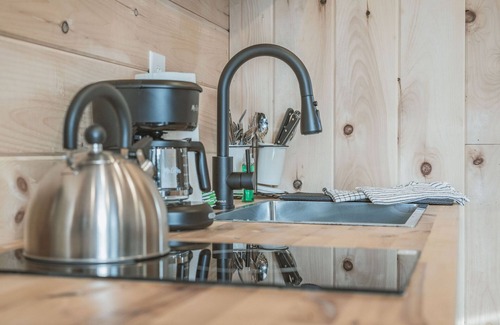 Grand Junction House | Tiny home with one queen bed on main floor.