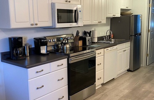 Admiral Estates Condo | Top floor unit with water view from bedroom!