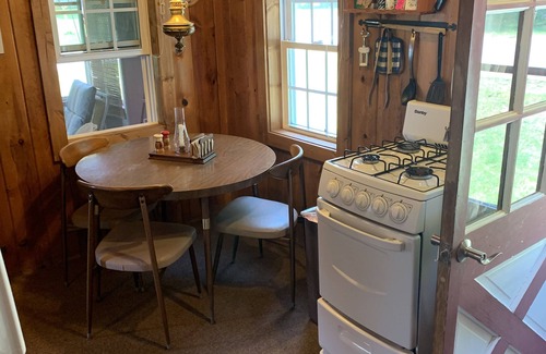 Kewadin Cottage | Torch Lake Village Cozy Cottage with private dock