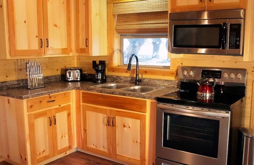 Cat Spring Cabin | Tranquility Cabin Surrounded By Live Oak Trees With A Fabulous Private Hot Tub!