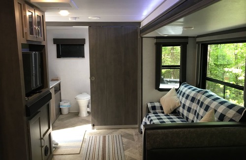 Norway House | Travel Trailer in the woods
