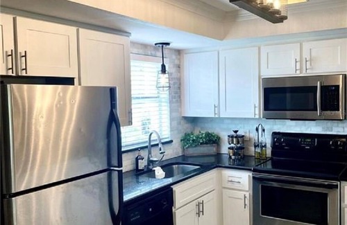 Capri Isle House | Treasure Island St Pete Beach FL 2BR 4BA Walk to Beach 3 level Garage Townhouse