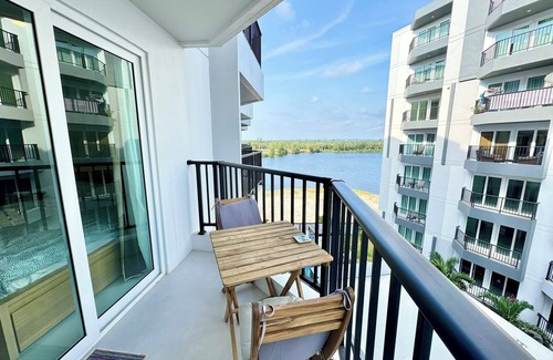 Kram Condo | Tropical beach nearby, Studio well-equiped kichen, AC, Wi-fi, Pools and Gym