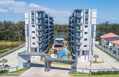 Kram Condo | Tropical beach nearby, Studio well-equiped kichen, AC, Wi-fi, Pools and Gym