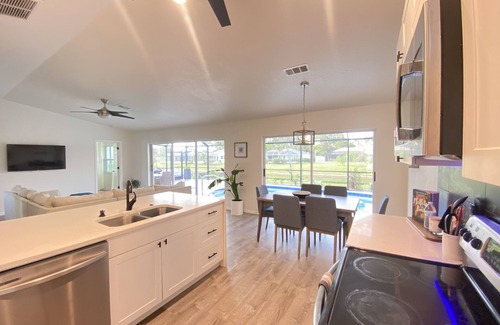 Long Meadow House | Tropical Oasis 3 bedroom 3 bath heated pool house, Beach 4 miles away