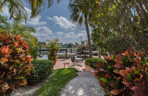 Gulf Harbors House | Tropical Waterfront Resort Home with Marina, Kayaks, Piano, Game Room