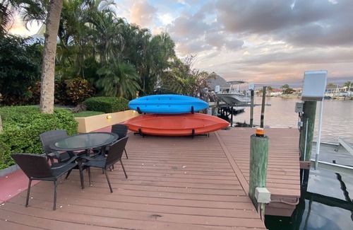 Gulf Harbors House | Tropical Waterfront Resort Home with Marina, Kayaks, Piano, Game Room