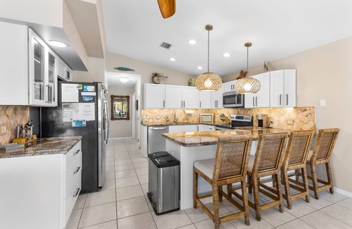 Key Colony Beach House | Tropicaribbean Retreat - Waterfront Ocean-side, Pool Club, XL Tiki hut, Kayaks