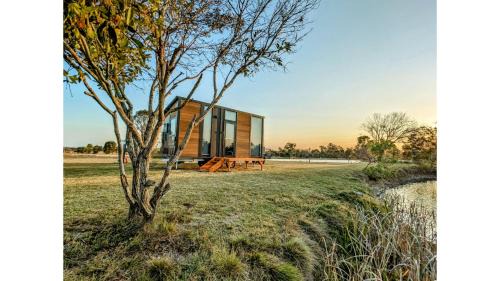 Burrum River House | Turtle Island Lakeside Tiny House by Tiny Away