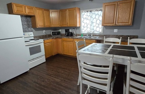 Monticello Cabin | Two Bedroom Cabin - "The Big One" - This spacious cabin gets it's name honestly! Cabin is 800 sq ft with two-bedrooms feature three (3) queen beds, one (1) full size bed, and two (2) futons allow for a max of twelve (12) people. Conveniently located