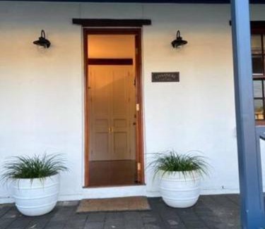 Grange House | Two roomed private suite in front of cottage