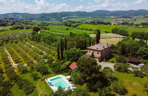 Torrita di Siena Villa | Typical villa with private swimming pool with panoramic view over the village of Torrita di Siena. S