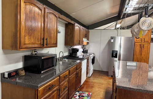 Fairbanks House | Unique camp style house with large wrap around deck.