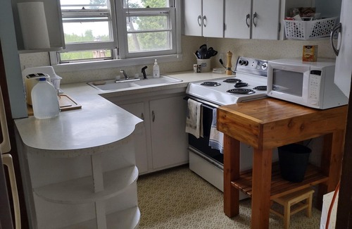 St Ignace Apartment | UP Mackinac Straits View Charming corporate apartment with WiFi by Saint Ignace.