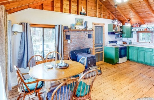 Charlotte Cottage | Updated lakefront home in a wooded setting with private dock & beach access