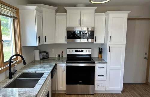 Harbor Springs Condo | Updated Phase 2 Hideaway Valley Condo Nestled in the Woods