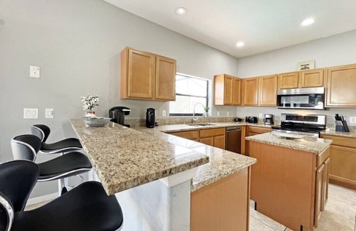Four Corners House | Upgraded pool home with hot tub and games/movie room - gated resort 6 miles from Disney!