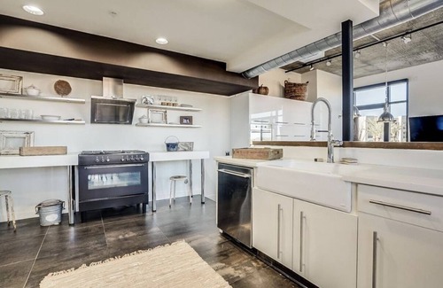 Brown and Stetson Business Condo | Urban chic loft, twinkling lights & mountain views