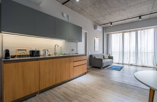 Vake Condo | Urban Loft Apt Ideal for Workcation, Couples & Families